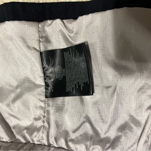 Black Spyder ski jacket with zip out liner that can be worn separately. - Picture 3 of 7